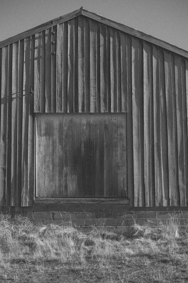 Weathered wooden barn door representing the Salt Folk Home Edit collection.